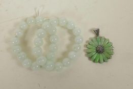 A 925 silver daisy shaped pendant set with green jade and marcasite, together with two jade beaded