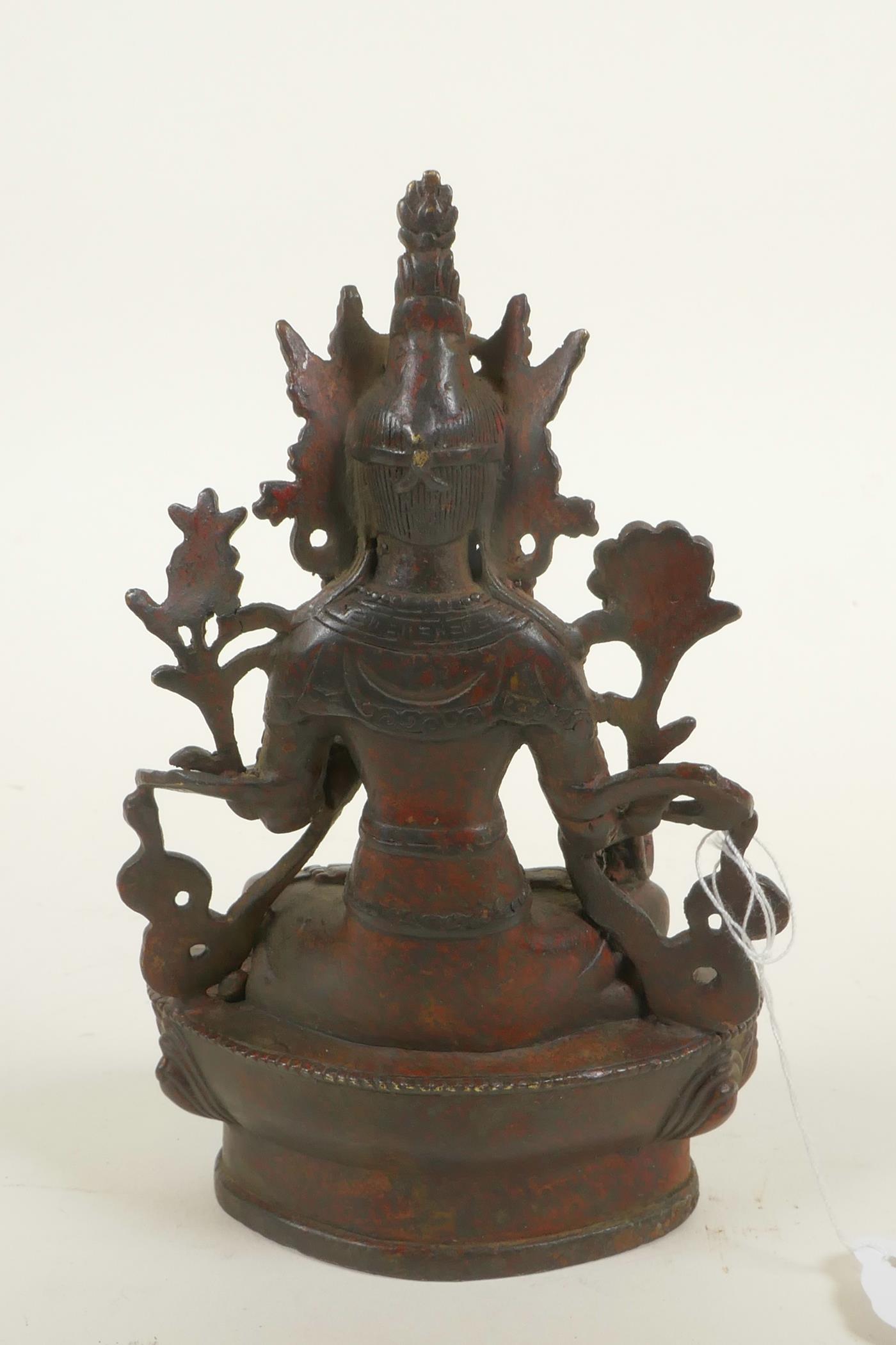 A bronze Buddhistic figure with red patination, 6¼" high - Image 3 of 4