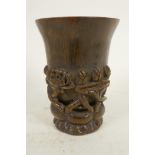 A Chinese horn libation cup carved with flowering lotus, 4¼" high