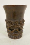 A Chinese horn libation cup carved with flowering lotus, 4¼" high