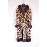A vintage Harrods ladies' leopard skin coat, in fine condition, 46" long