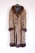 A vintage Harrods ladies' leopard skin coat, in fine condition, 46" long