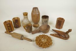 A quantity of various Indo-Persian pottery and treen items to include vases, cups, spice holders,