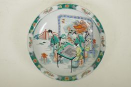 A Chinese famille verte porcelain charger decorated with figures playing Go, 6 character mark to