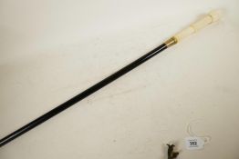 A hardwood walking cane with bone handle carved as wickerwork, 39" long