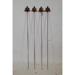 A set of four decorative iron plant stakes, 42½" high