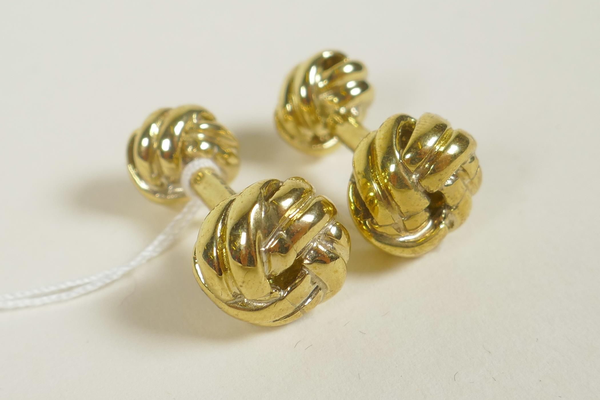 A pair of gold plated 'knot' cufflinks