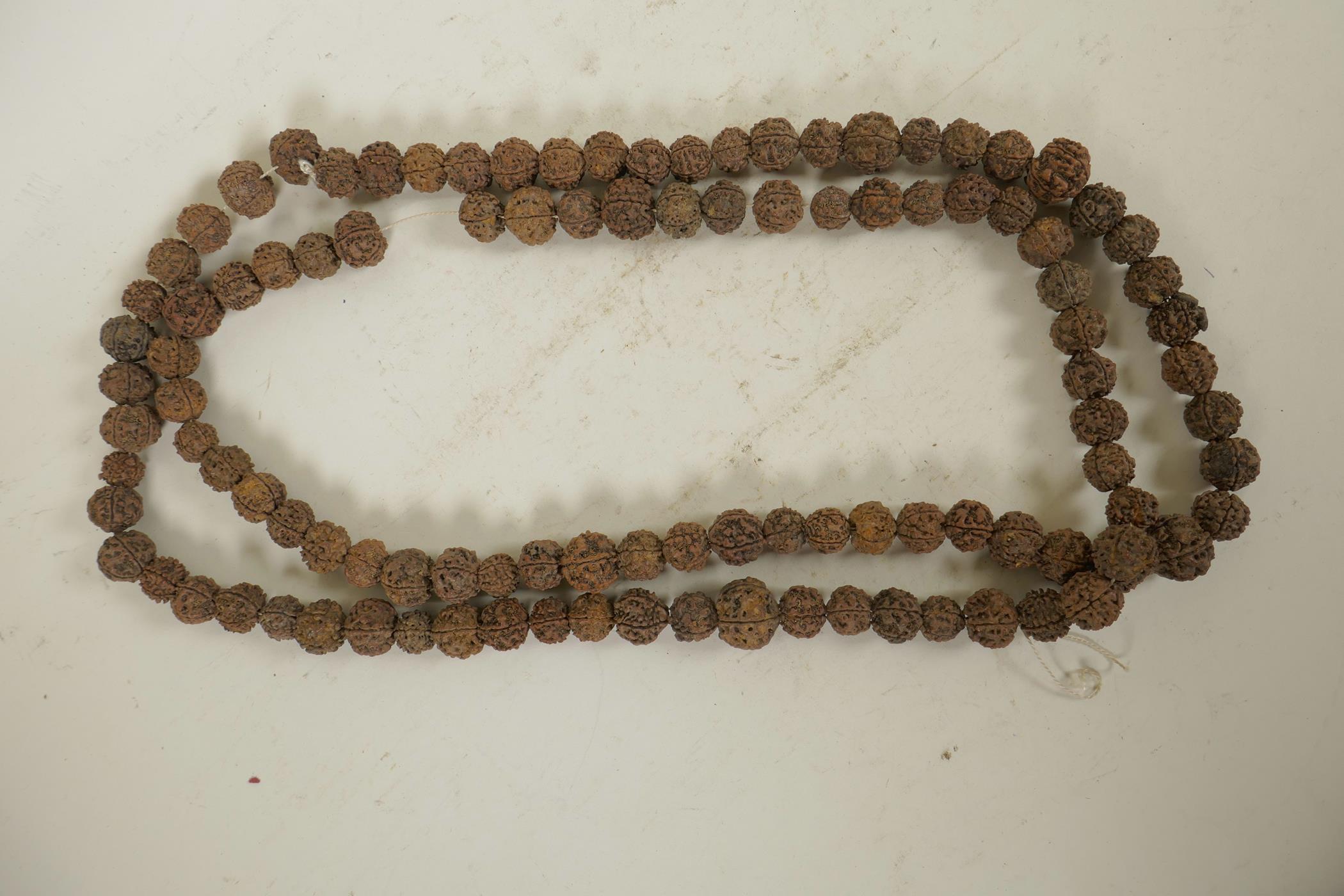 A string of nut kernel beads, 66" long