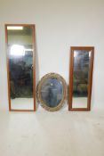 A gilt composition oval wall mirror and two other hall mirrors, largest 62" x 20"