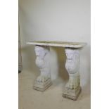 A vintage painted reconstituted stone/concrete garden console table raised on winged griffin
