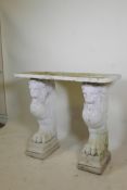 A vintage painted reconstituted stone/concrete garden console table raised on winged griffin