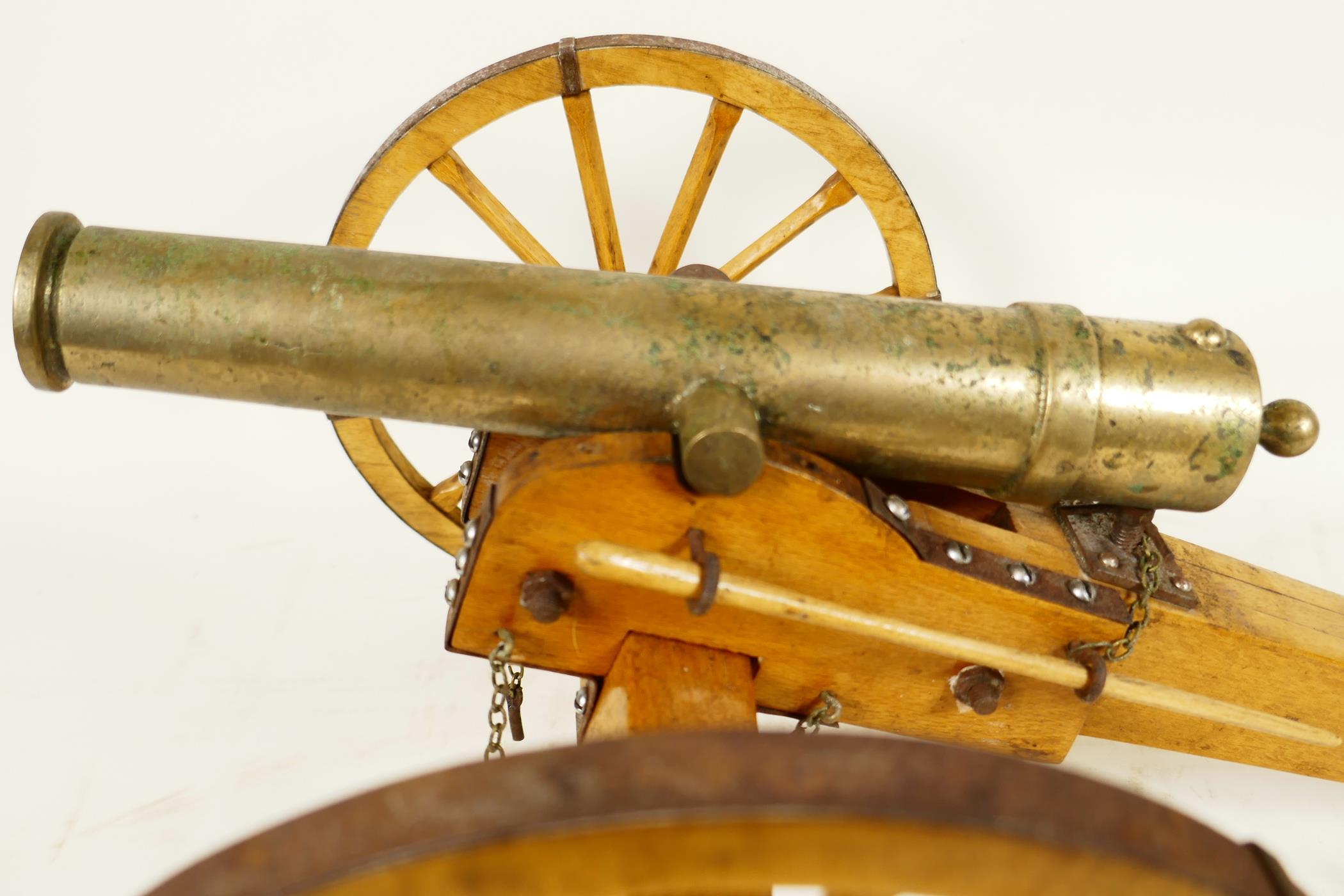 An antique ornamental table top bronze cannon, on a hand made wooden carriage with metal fittings, - Image 2 of 4