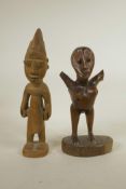 An African carved hardwood tribal figure, and another, one armless, 13" high