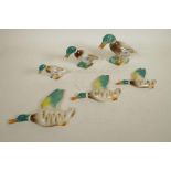 A set of thee 1940s Keele Street Pottery graduated flying wall ducks, hand painted and glazed