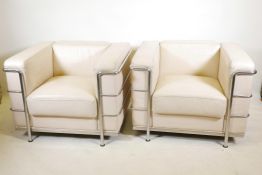 A pair of Le Corbusier style white leather and chrome LC2 armchairs, 35" x 29", 26" long