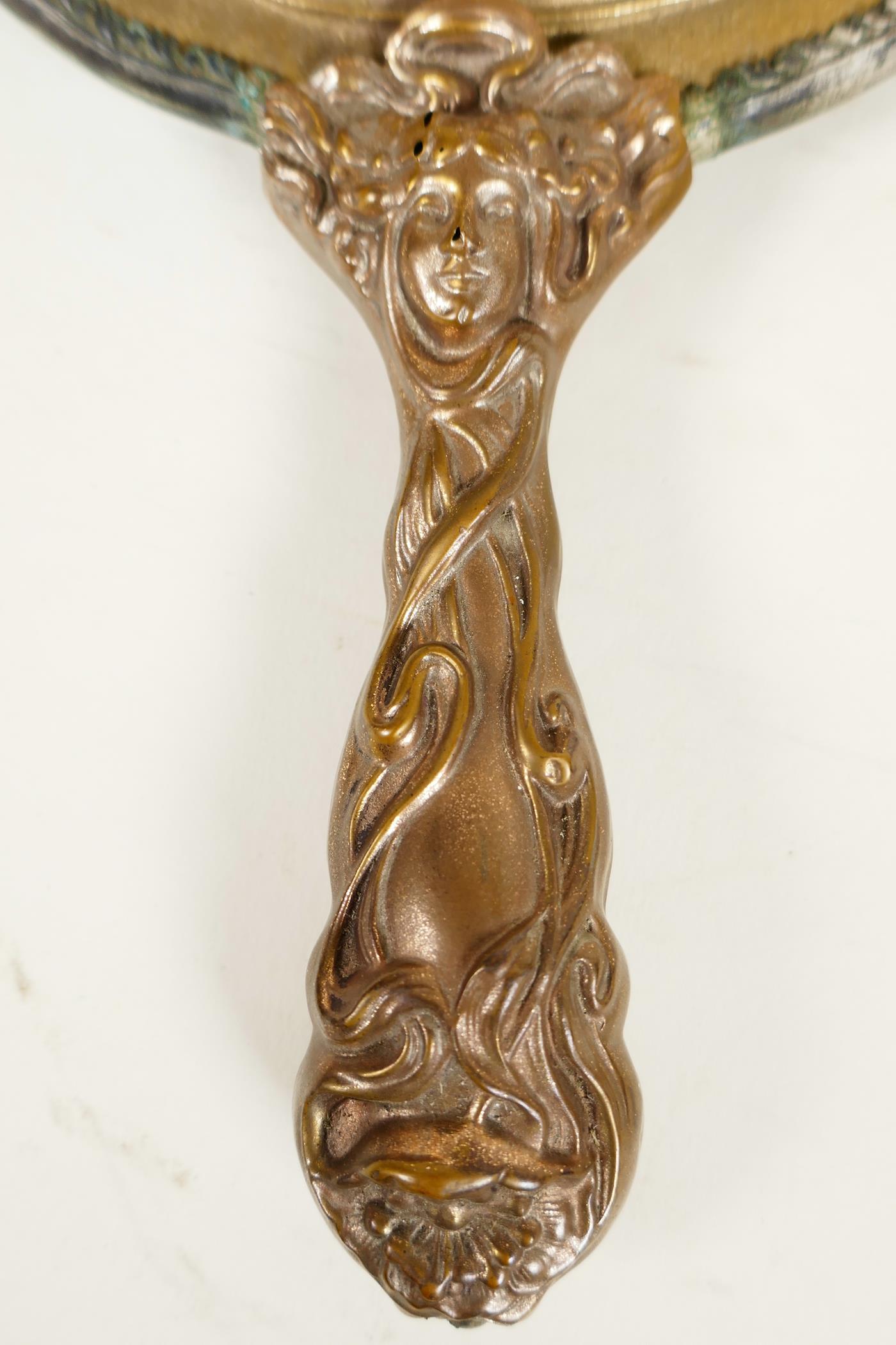 A C19th Art Nouveau bronze hand mirror embossed with scrolls and faces, and bejewelled glass mirror, - Image 2 of 4