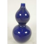 A small Chinese blue glazed porcelain double gourd vase with seal mark to base, 4½" high