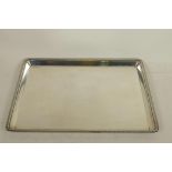 A hallmarked silver tray from the Goldsmiths and Silversmiths Company, London, 11" x 8", 576g