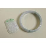 A Chinese marbled green jade bangle, and a carved jade pendant with dragon tortoise decoration,