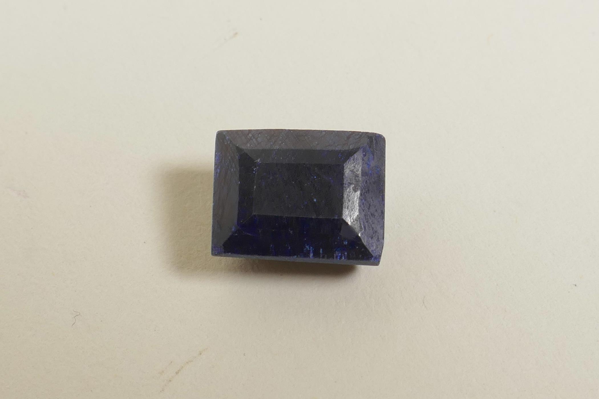 A 10.70ct natural blue sapphire, rectangular step cut, colour enhanced, certified by Gemological - Image 2 of 3