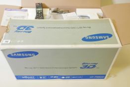 A Samsung HT-F6500 Blu-Ray 3D/DVD home entertainment system in original box, appears complete,