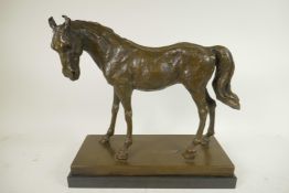 A bronze figure of a horse after Mene on a bronze and marble plinth, 12" high