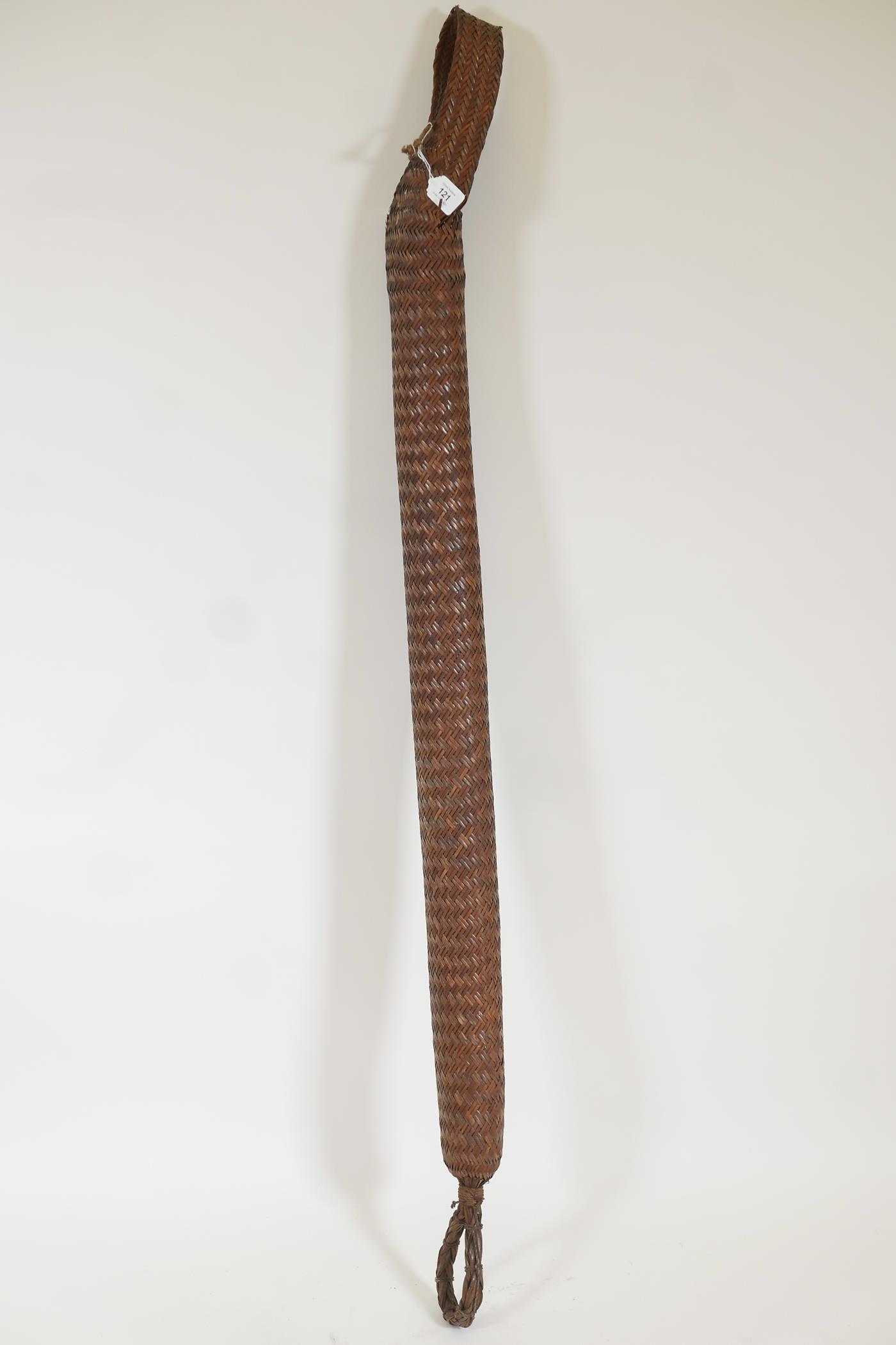 A Nagaland long woven rattan basket, 59" long