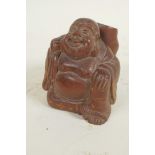 A Japanese okimono carved as a jolly man with large sack, 2¼" high