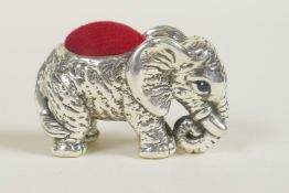 A sterling silver pincushion in the form of an elephant, 1½"