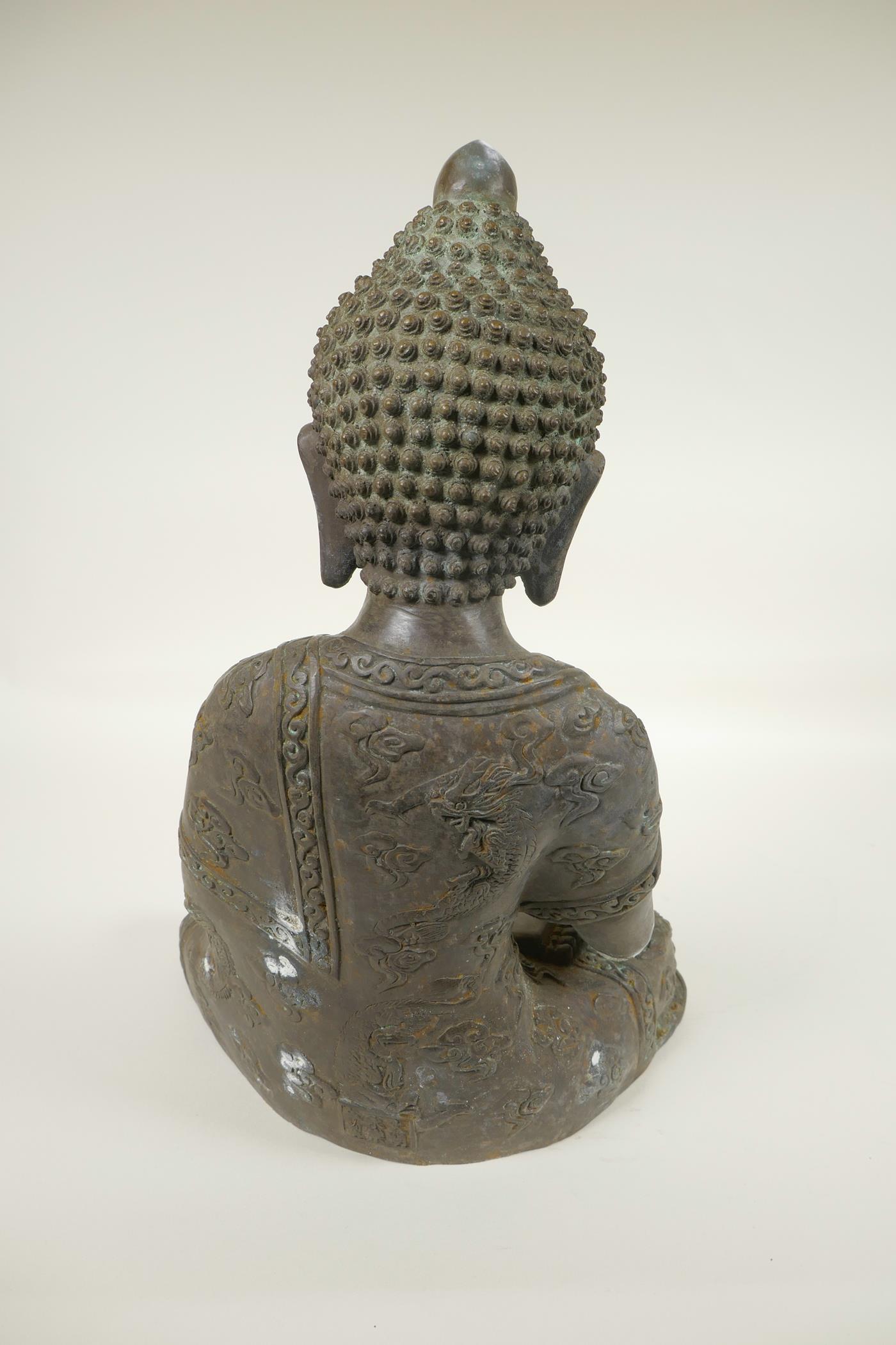 A Chinese cast bronze figure of Buddha seated in the lotus position whilst meditating, cast 6 - Image 4 of 5