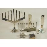 A Menorah, 9" high, another nine light candlestick, a pair of square section candlesticks, a small