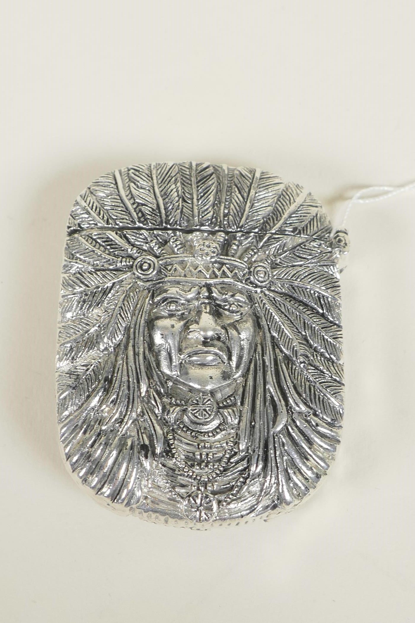A silver plated vesta case decorated with a Native American brave, 2"