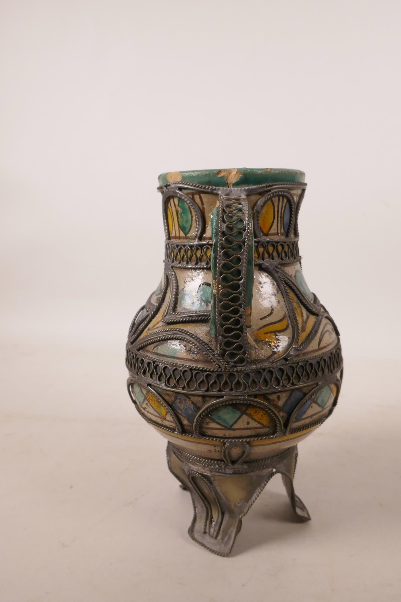 A North African pottery ewer with metal mounts, A/F repair to rim, 7½" high - Image 4 of 7