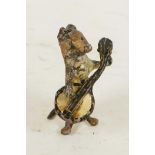 A miniature cold painted bronze figurine of a dog playing a banjo, 1¾" high