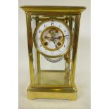 A Tiffany brass cased four glass mantel clock with exposed Brocot escapement and mercury pendulum,