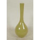 A Japanese yellow glazed specimen vase with bulbous body and long slender neck, 6½" high