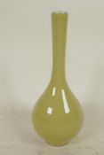 A Japanese yellow glazed specimen vase with bulbous body and long slender neck, 6½" high