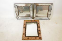 An Indian wood wall mirror with decorative metal mounts, 24" x 18", and a pair of metal framed