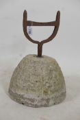 An antique limestone and wrought iron boot scraper, 18" high