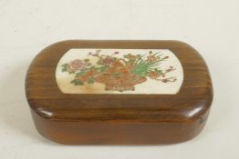 A small Japanese hardwood box, the cover with inset bone panel decorated with a basket of flowers,