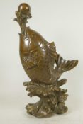 A Chinese bronze figure of a carp supporting a pearl on a water jet, 16" high