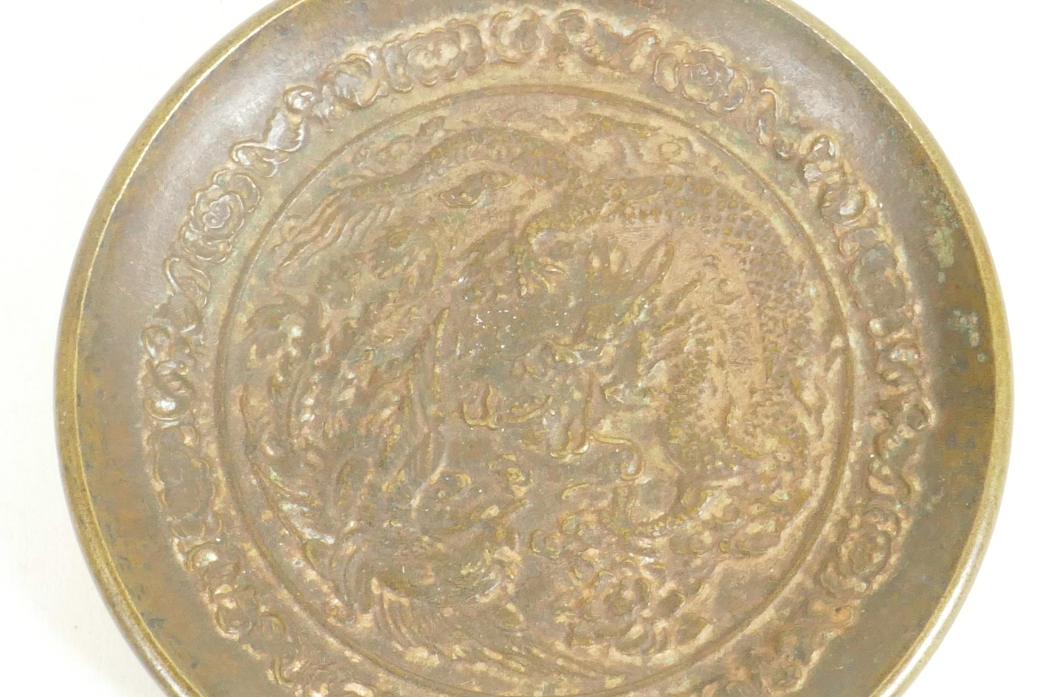 A Chinese bronze pin tray embossed with a fiery dragon, 3" diameter - Image 2 of 3