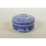 A Chinese blue and white porcelain cylinder box and cover with dragon decoration, 6 character mark