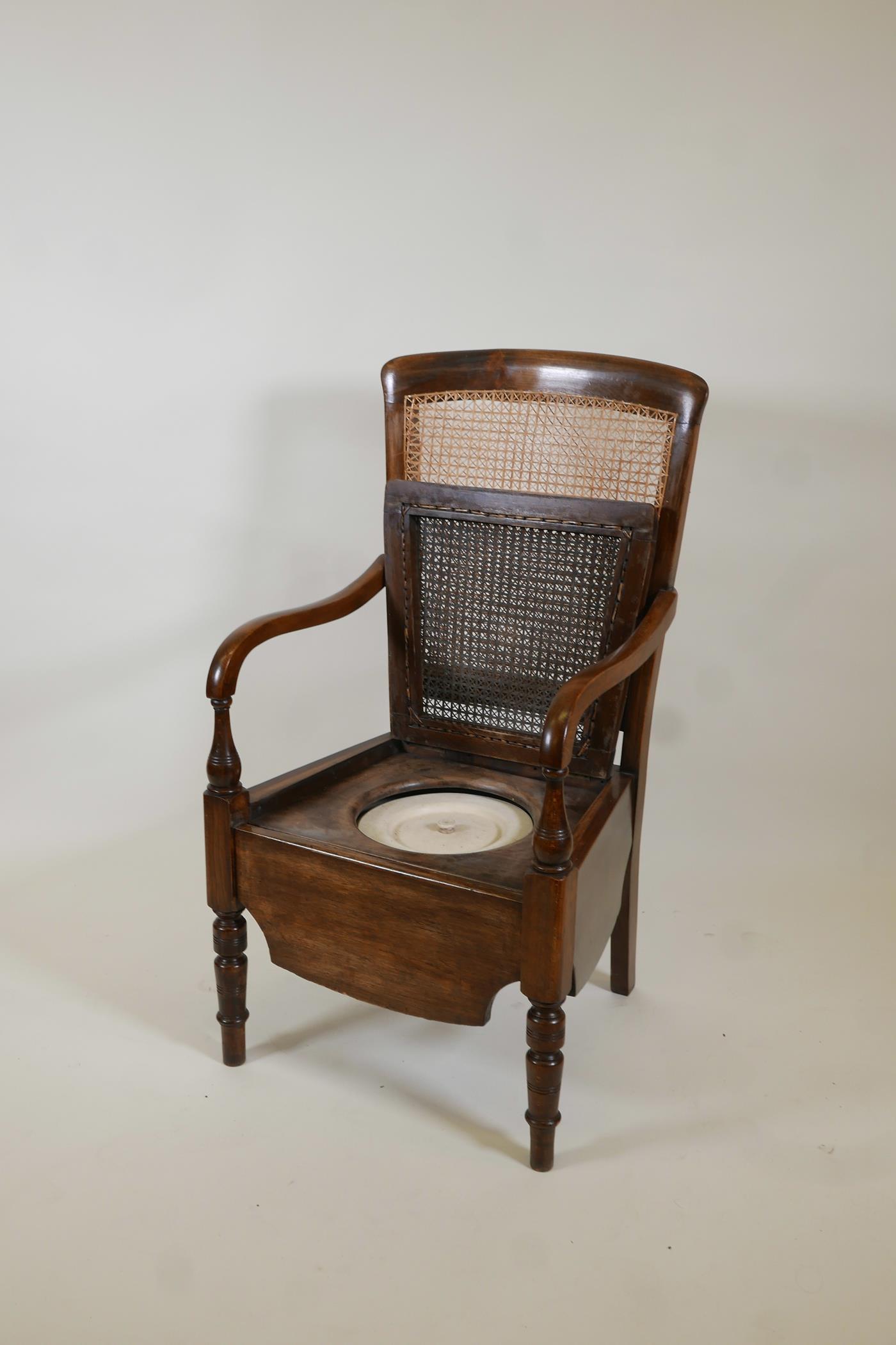 A beech framed commode armchair with bergere panel back by Carter's Ltd, 39" high - Image 2 of 3