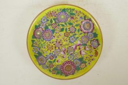 A Chinese polychrome enamelled porcelain cabinet dish with all over Asiatic flower decoration, 6