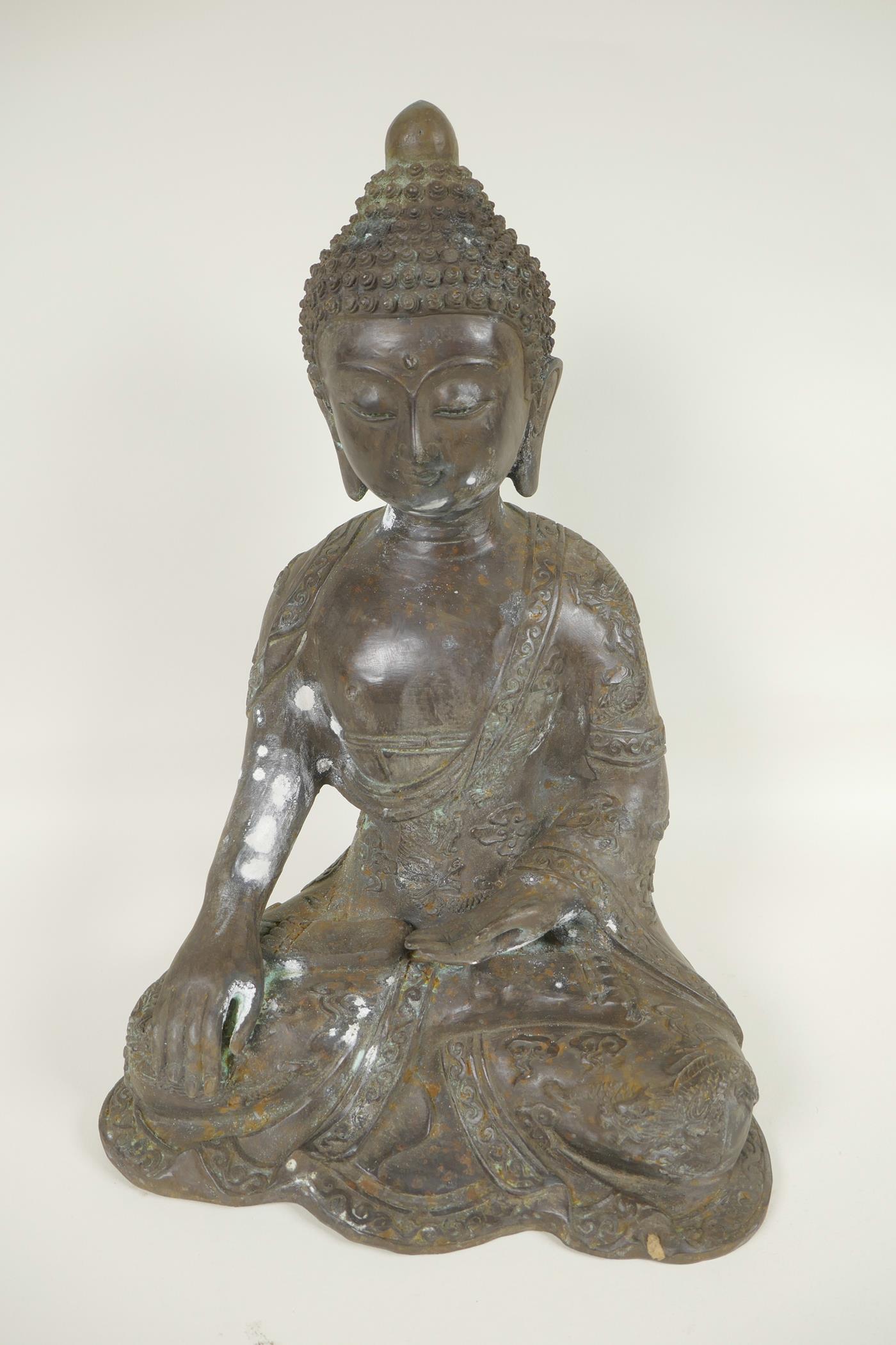 A Chinese cast bronze figure of Buddha seated in the lotus position whilst meditating, cast 6