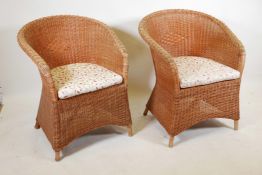 A pair of contemporary tub chairs