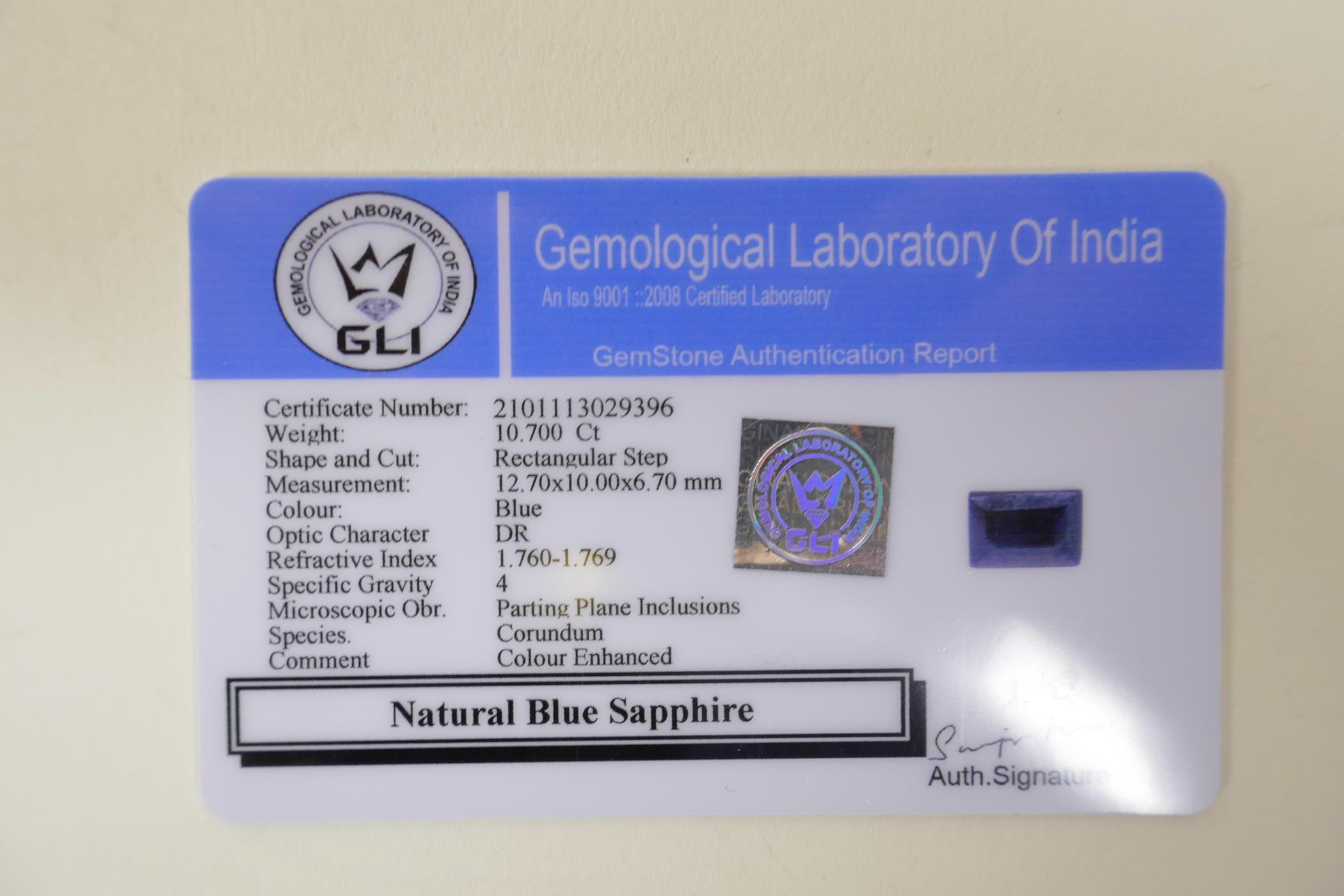 A 10.70ct natural blue sapphire, rectangular step cut, colour enhanced, certified by Gemological - Image 3 of 3