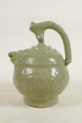 A Chinese Song style celadon glazed pottery oil pourer/pot with raised kylin and floral