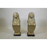 A pair of gilt moulded concrete garden lions, 31" high